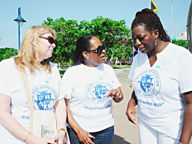 Alison Bethel McKenzie (centre), executive director, International Press Institute (IPI), Vienna, Austria; shares some pointers with Jenni Campbell (right), president of The Press Association of Jamaica, and Marthy Steffens (left), professor, University of Missouri, journalist and board member, IPI, pictured during the World Press Freedom event in Jamaica.
