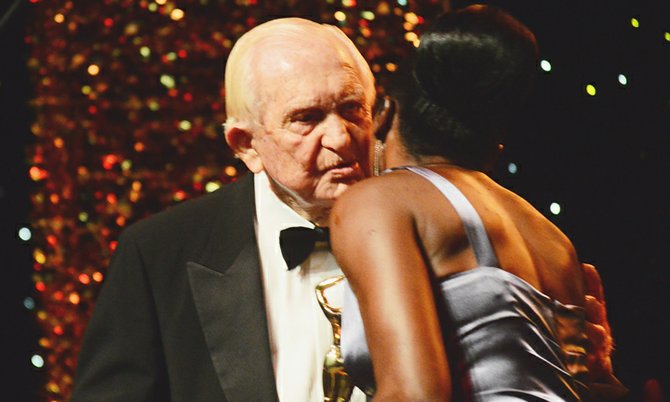 A kiss for Sir Durward Knowles, winner of the lifetime achievement honour at Saturday night’s Icon Awards. He received the Icon trophy - and his kiss - from Golden Girl Pauline Davis-Thompson. 
Photo: Lamond Johnson/Tribune Staff

