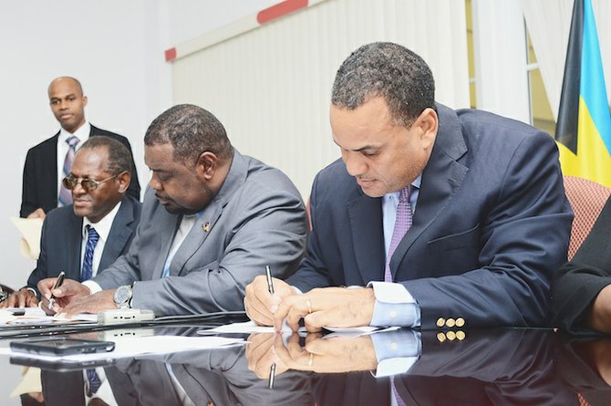 President of The Bahamas Public Service Union (BPSU) John Pinder and Minister of State of Finance Michael Halkitis yesterday signed a new industrial agreement for public servants.Photo: Lamond Johnson/Tribune Staff
