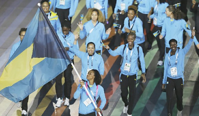 MAKING BAHAMIANS PROUD: Arianna Vanderpool-Wallace leads the team during the opening ceremony Wednesday for the 20th Commonwealth Games in Glasgow, Scotland, on Wednesday, July 23, 2014. 
(AP Photo/Kirsty Wigglesworth)
