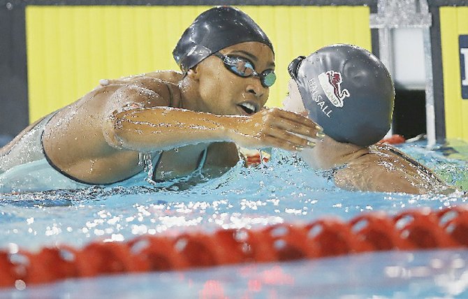 Arianna VANDERPOOL-WALLACE (left) and England’s Francesca Halsall celebrate after the Women’s 50m Butterfly at the Tollcross International Swimming Centre during the Commonwealth Games 2014 in Glasgow, Scotland, on Sunday July 27.
