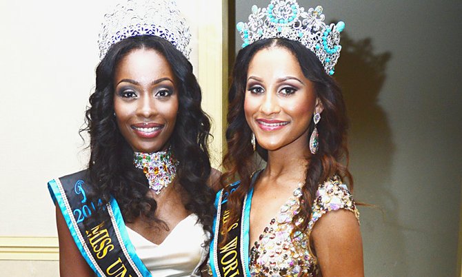 GRAND BAHAMA beauty queens Tomii Culmer (left) and Rosetta Cartwright pose together after winning the Miss Bahamas Universe and Miss World Bahamas crowns respectively at the Atlantis, Paradise Island, resort on Saturday night.