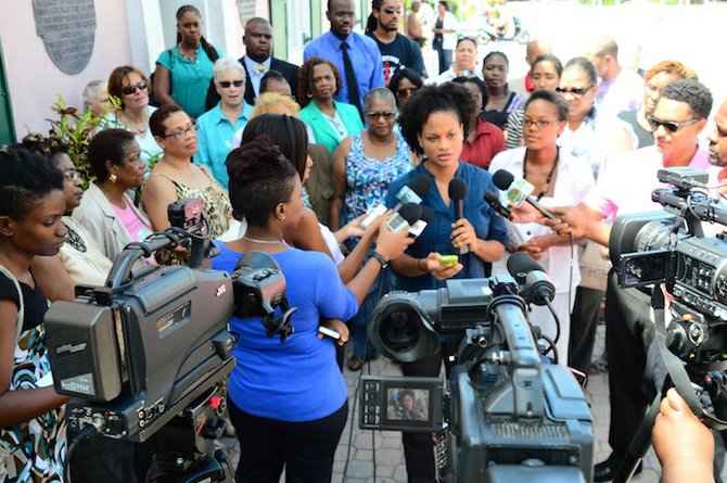 Activist Terneille Burrows speaks to the media during the press conference held by the Bahamas Crisis Centre outside the House of Assembly.
