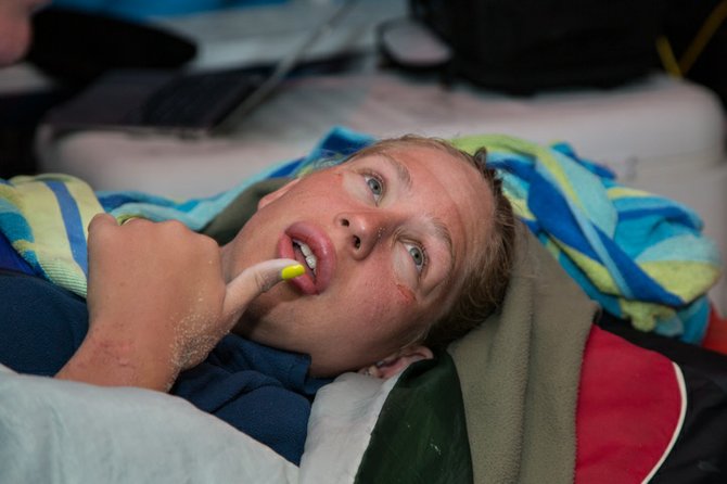 Australian ultra-marathon swimmer Chloe McCardel gives the thumbs up sign as she recovers at the end of her marathon swim.