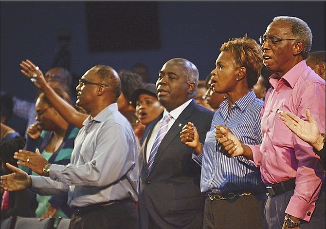 Deputy Prime Minister Philip ‘Brave’ Davis among the congregation at Bahamas Faith Ministries last night. 
Photos: Shawn Hanna/Tribune Staff