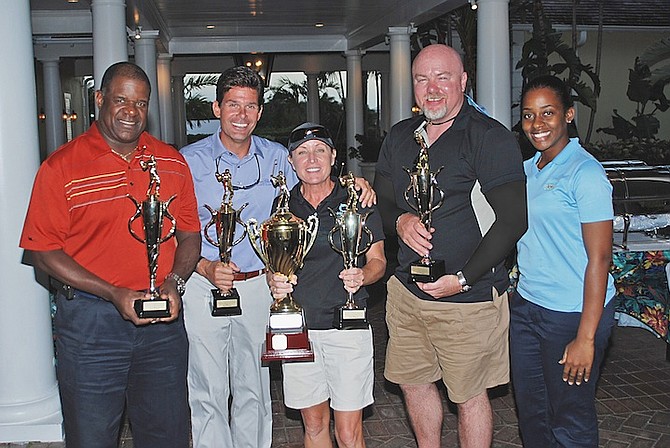 THE WINNERS: Although more about fun and camaraderie than competition, the team of Ted Adderley, Greg Charbeneau, Teri Corbett and Sean Manire took 1st place overall. At far right is Janelle Hucheson, Atlantis HR.
