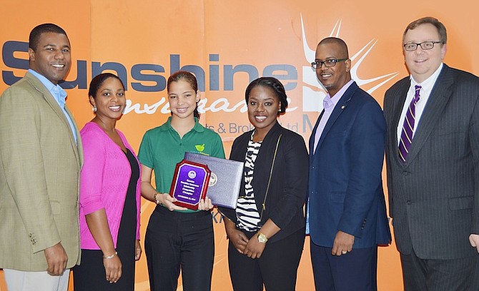 From left, Arawak Homes president Franon Wilson; Sunshine Insurance Agents & Brokers vice-president of Operations Shelly Wilson; first place winner of the 13th Annual Sunshine Insurance - Elmira College Essay & Speech Competition Brittney Wells; Elmira College student Alicia Burns; Sunshine Insurance Agents & Brokers vice-president of development Dwayne Swaby and vice-president & chief of staff at Elmira College, Michael Rogers.
