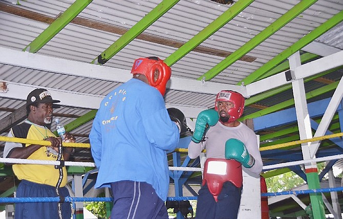 STICK AND MOVE: Meacher ‘Pain’ Major (far right) can be seen during a sparring session with heavyweight Jerry “Big Daddy” Butler (blue).
                                                                                                                                                                                                                                                                  Photo by Nakita Lockhart Photography
