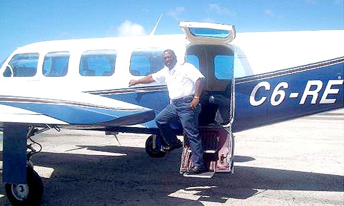 Pilot of the flight Rufus Ferguson is pictured with the plane that crashed.