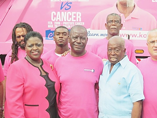 The USToo Bahamas Chapter Men’s Prostate Cancer Group played a critical role in Hartley Strachan’s (centre) recovery from prostate cancer.  Chapter leader Valentine Maura (second right) and Social Services Minister Melanie Griffin were on hand for the “Big Pink” unveiling. 
BIS Photo/Matt Maura