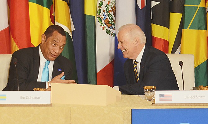 Prime Minister Perry Christie shares a light moment with US Vice-President Joe Biden at the Caribbean Energy Security Summit in Washington, DC yesterday. Discussions were held towards the objective of Caribbean energy security, energy diversification, and cleaner sources of energy.  Photo: Peter Ramsay/BIS