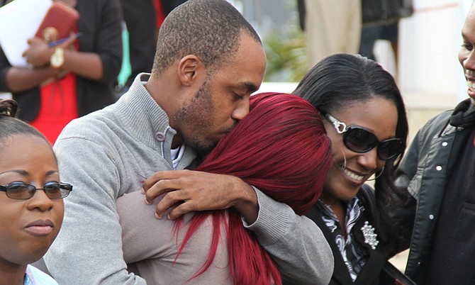 Emmanuel Lewis Jr is embraced after leaving court yesterday having been released on bail. He is accused of the production of child pornography.