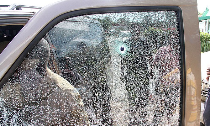 THE bullet-riddled car outside a home in Yellow Elder where an elderly woman was killed.