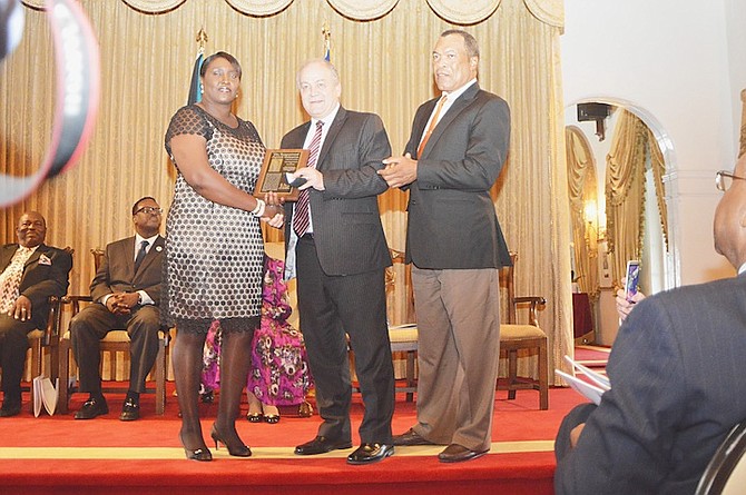 HALL OF FAME: Shown (l-r) are Oria Wood-Knowles, Dale McMann, president of the ISF and vice president of the World Baseball/Softball Confederation and Bahamas Olympic Committee president Wellington Miller.  Photos by Kevin Major

