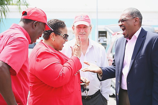 FNM leader Dr Hubert Minnis and Loretta Butler-Turner at yesterday's demonstration outside the Ministry of Agriculture, Marine Resources and Local Government.