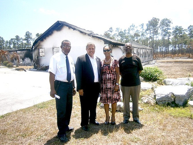 Pastor Eddie Victor and his wife, Margo, of Living Water Assembly of God Church, (centre)  have started a building fund to aid in the rebuilding of the church in Chesapeake.  Also seen is Jackson Davis, congregation member, left; and Pastor Nelson Bain, of New Beginning Life Church.  
