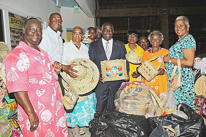 Deputy Prime Minister Philip ‘Brave’ Davis with straw market vendors who have donated items to their compatriots in Exuma. 