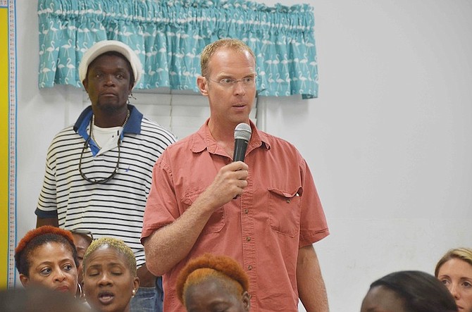 Exuma resident Adam Stenftenagel speaking at the town meeting held to discuss the straw market fire on the island. 