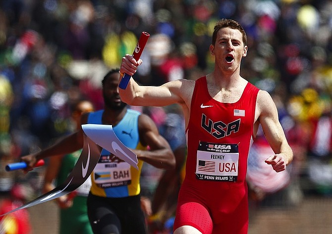 ON TRACK: Patrick Feeney, of the US, crosses the finish line ahead of Ramon Miller to win USA vs the World 4x400-metre race at Penn Relays on Saturday in Philadelphia.         
                                                                                                                                                                                                                                                                               (AP Photo/Rich Schultz)