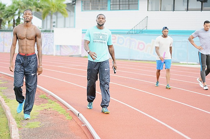 TEAM USA members, including Olympic gold medallist (100m) Justin Gatlin (second from left), in training for the BTC/IAAF World Relays Bahamas 2015 at the original TAR stadium yesterday. 
                                                                                                                                                                                   