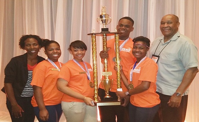 THE winning Anatol Rodgers High School team of Dezeraye Dean, Ameera Poitier, Vernajh Pinder and Jeanie Farris with their coach, Janelle Cambridge-Johnson (left) and Ernest P Boger, chairman of Hospitality and Tourism Management at the University of Maryland Eastern Shore in Orlando (right).

