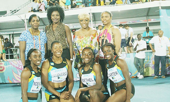 PASSING ON THE BATON: Standing (l-r) are ‘Golden Girls’ Sevatheda Fynes, Pauline Davis-Thompson, Eldece Clarke and Chandra Sturrup. Kneeling (l-r) are V’Alonée Robinson, Debbie Ferguson-McKenzie, Brianne Bethel and Tayla Carter during the 2nd IAAF/BTC World Relays at Thomas A Robinson National Stadium May 2-3, 2015.
Photo by Raymond A Bethel Sr/BIS
