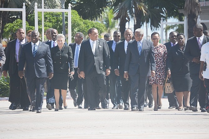 Government ministers on their way to Parliament yesterday. Photo: Shawn Hanna/Tribune Staff