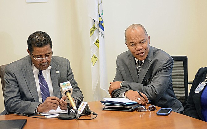 Dr Perry Gomez, Minister of Health, and Herbert Brown, managing director of the Public Hospital Authority.