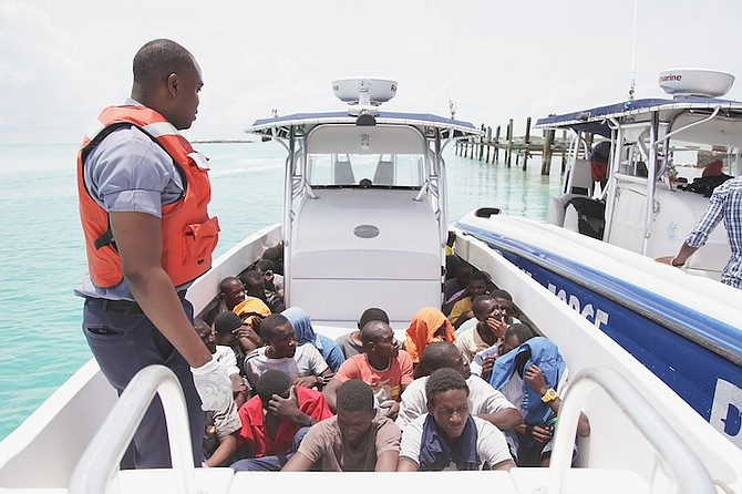 Some of the 92 Haitian migrants detained by the Royal Bahamas Defence Force at Exuma after their sloop sank. See page five for the full story. Photo: Marine Seaman Stefan McDonald/RBDF Public Relations
