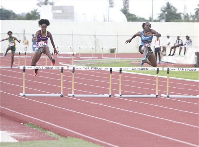 SETTING THE PACE: Dreshanae Rolle (far right) won the 400 metres hurdles in the Bahamas Association of Athletic Associations Junior National Track and Field Championships at Thomas A Robinson Track and Field Stadium over the weekend.
                                                                                                                                                                                                                                                            Photo by Tim Clarke/Tribune Staff
