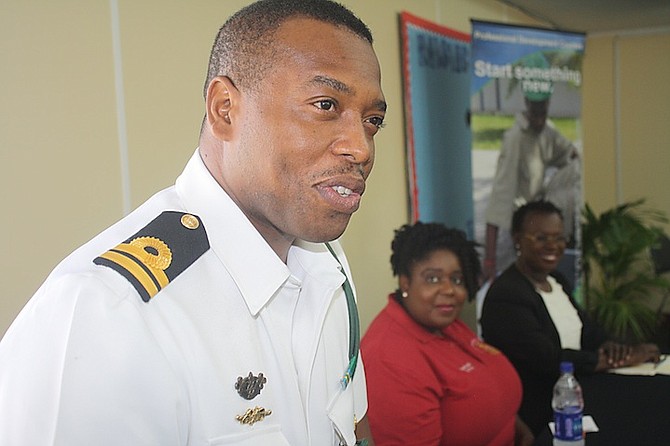 Royal Bahamas Defence Force assistant training officer Senior Lieutenant Origin Deleveaux addressing BTVI students during its career expo and trade fair. Also pictured are Royal Bahamas Police training officer Vanessa Arthur and Ministry of the Public Service office manager Debra Foulkes.