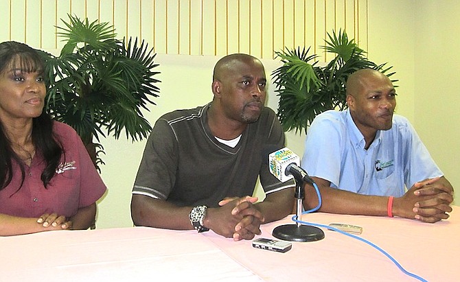 Retired NBA player Kenny Anderson, centre, is in Grand Bahama holding a basketball camp from today until Sunday at the YMCA. Also pictured are DeCarlo Deveaux, sales and marketing manager at Castaways Resort, who helped organise the event. Far right is Elaine Pinder, financial controller at Castaways Resort. Anderson is pictured below in his NBA days. Photo: Denise Maycock/Tribune Staff