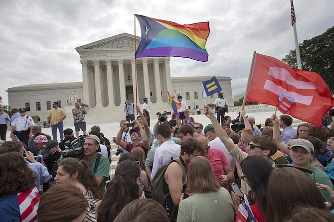 The crowd reacts as the ruling on same-sex marriage was announced outside of the Supreme Court in Washington, Friday. (AP)