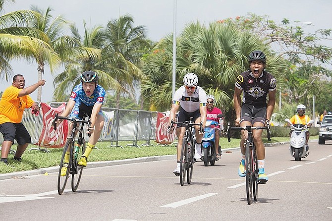 FINISH LINE: Jay Major (far right) is ecstatic at winning the national cycling road race championship with Liam Holowesko, left, inches away in second and Chad Albury (centre) third.             
Photo by Jonathan Thompson  
                          