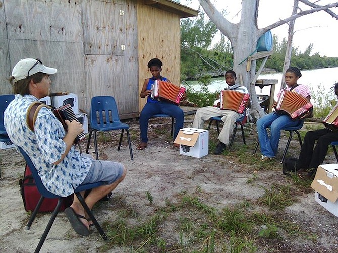 Cat Island youngsters learn to play the accordion with specialist Robert Santiago.