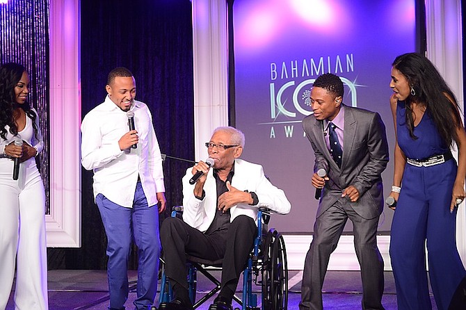 Ronnie Butler on stage at the Bahamian Icon Awards with, from left, Wendi Lewis, Osano Neely, Dyson Knight and Angelique Sabrina. 
Photo: Aaron Davis