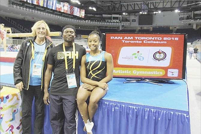 AN HISTORIC PERFORMANCE: Bahamian gymnast Kianna Dean (far right) with coach Trevor Ramsey (centre) and Barbara Thompson, president of the Bahamas Gymnastics Federation, at the Pan American Games in Toronto, Canada.
