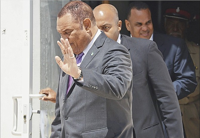 Prime Minister Perry Christie and Michael Halkitis, Minister of State in the Ministry of Finance, leaving the House of Assembly yesterday as questions about Baha Mar talks continued to swirl. Photo: Shawn Hanna/Tribune Staff