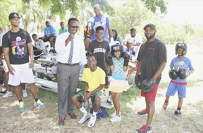 MInister of Sports Daniel Johnson takes a photo with young boxers at Camp Carmichael. 
Photos: Tim Clarke/Tribune Staff