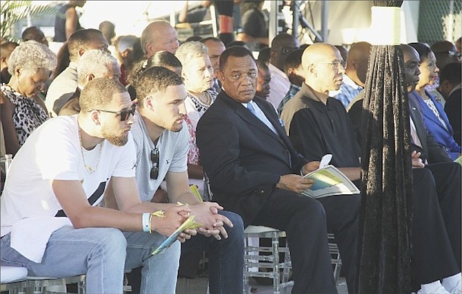 AN HISTORIC DAY: Prime Minister Perry Christie sits beside Mychal “Sweet Bells” Thompson and his two sons - Klay and Mychel Thompson - during a ceremony last night to officially unveil The Mychal “Sweet Bells” Thompson Boulevard at the Queen Elizabeth Sports Centre.
Photo by Tim Clarke/Tribune Staff