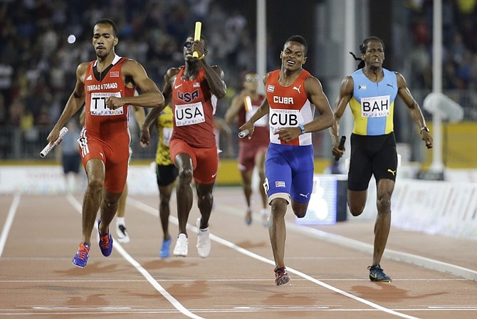 Jeffery Gibson (right) at the end of the controversial 4x400m final. (AP)