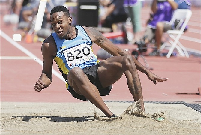 Leevan Sands, of the Bahamas, competes in the triple jump final at the Pan Am Games on Friday in Toronto. 
 (AP Photo/Gregory Bull)