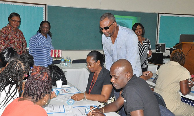 Jerome Fitzgerald, the Education Minister, tours Sir Jack Hayward Junior High School as part of his inspection tour of Grand Bahama schools on Friday. Photo: Vandyke Hepburn