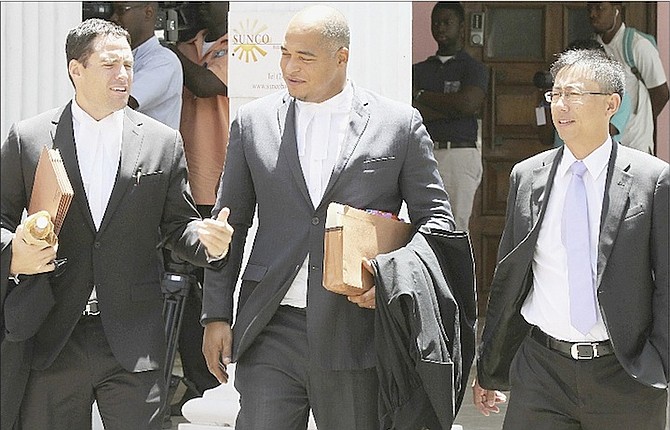 Lawyers outside court yesterday during hearings on liquidation proceedings for Baha Mar. 
Photo: Tim Clarke/Tribune Staff