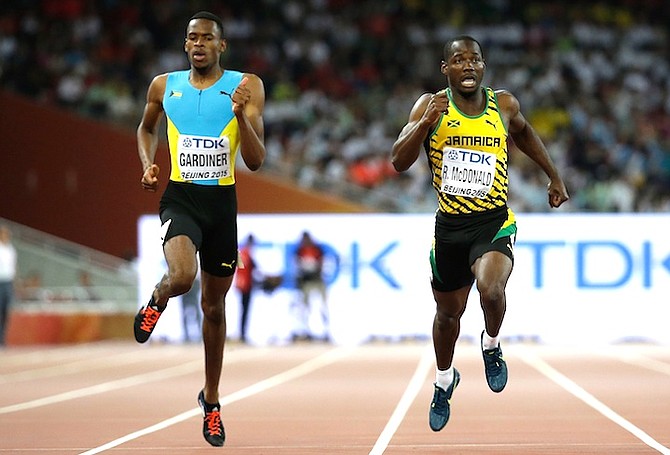 Steven Gardiner and Jamaica's Rusheen McDonald (right) compete in the men’s 400m semifinal at the World Athletics Championships at the Bird's Nest stadium in Beijing. (AP)