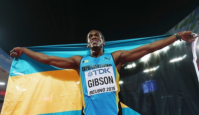 Jeffery Gibson celebrates after winning the bronze medal in the men's 400m hurdles final. (AP)