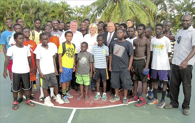 Andrew Law and Sally Van Tooren, co-founders of the Family Help and Support Foundation, are pictured (centre) with basketball camp assistants, Mark Beckford and William Lunn, and Dr David Allen and the participants in the programme.	Photo: Serena Williams PR