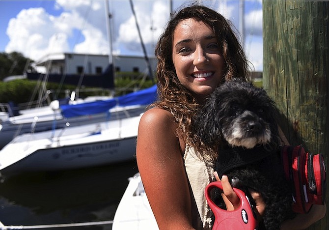 Sally Gardiner-Smith and her dog Elli, who went by sailboat on a nine-month journey.
Photo: Jay Conner/Tampa Tribune via AP