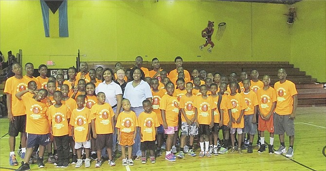 A SMALL WELCOME: Pandora Knowles, Bryan Russell and Welliya Cargill are welcomed by D-Squad Basketball campers.