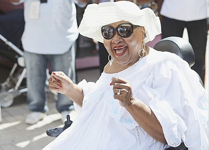 An excited Rasheeda Ali-Seck as she is welcomed and celebrated by her family, Bahamian band, vendors, taxi drivers and more for her 80th birthday. Photos Shawn Hanna
